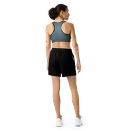 TSK Unisex Athletic Long Shorts — back view on woman model