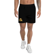 TSK Unisex Athletic Long Shorts — front view on model with sneakers