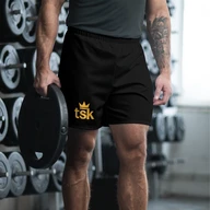 TSK Unisex Athletic Long Shorts — front view at the gym