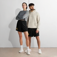 TSK Unisex Athletic Long Shorts — front view on two models