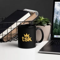 black mug — desk with laptop