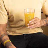 TSK Logo Glass — lifestyle front view